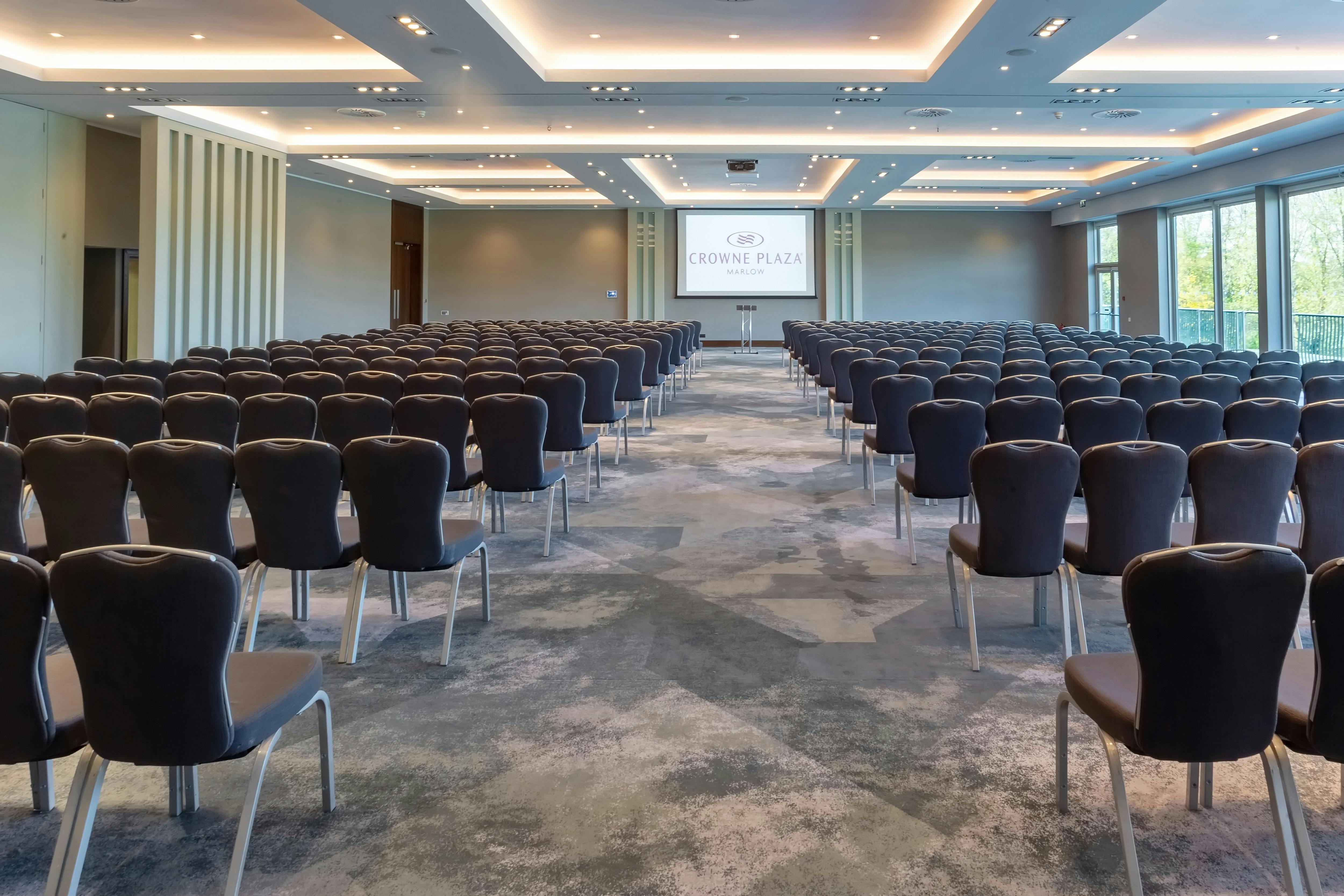 Winterlake Suite conference room with chairs and presentation screen, ideal for events.