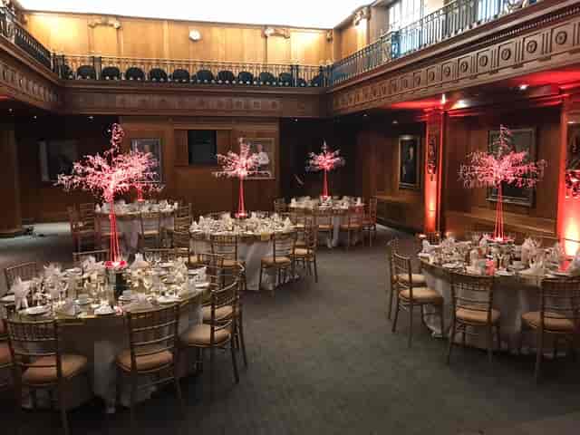 Elegant event space in Old Library, Lloyd's with round tables for formal dinners.