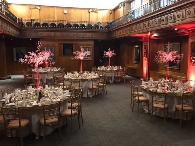 Elegant event space in Old Library, Lloyd's with round tables for formal dinners.