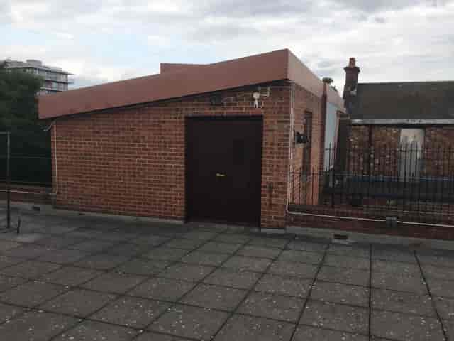 Rooftop venue at The Midi Music Company with brick structure for unique outdoor events.