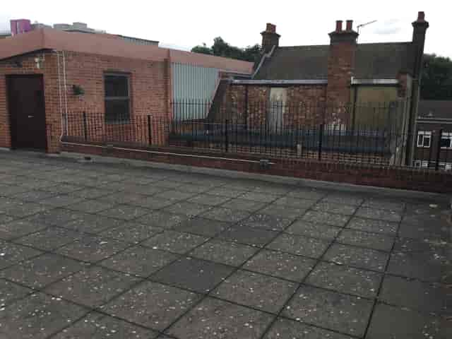 Rooftop event space at The Midi Music Company with open area for gatherings.