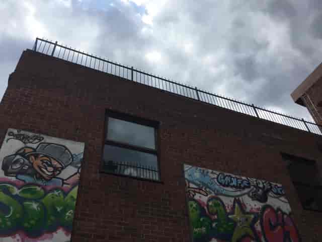 Urban courtyard venue with graffiti walls, ideal for creative outdoor events.