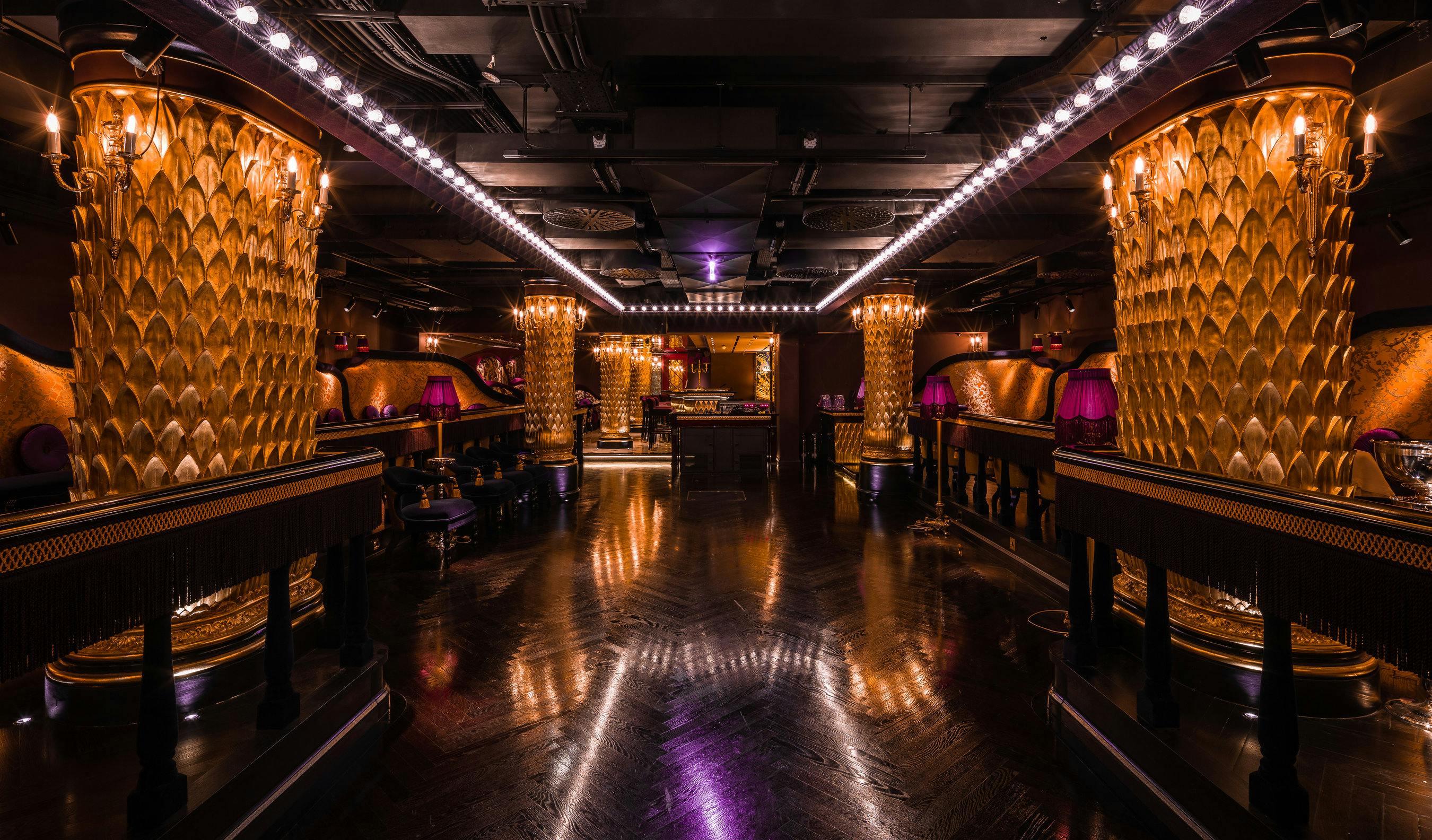 Luxurious Club Chinois event space with golden pillars, perfect for upscale gatherings.