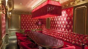 Luxurious red meeting space at Salon Rouge, ideal for corporate retreats and exclusive events.