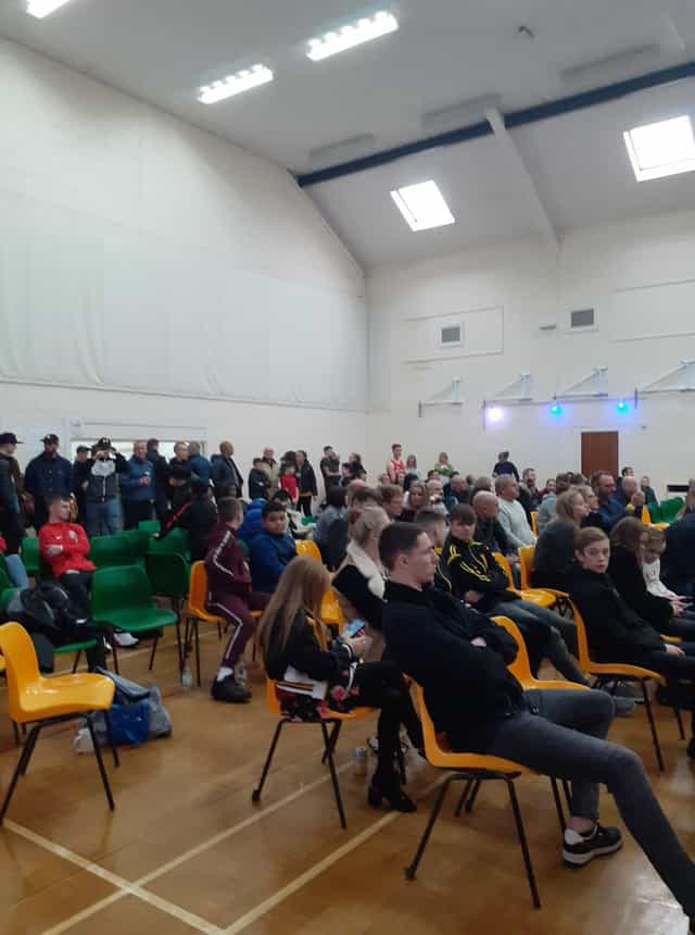 Diverse audience in Main Hall at Wickham Community Centre for a community event.