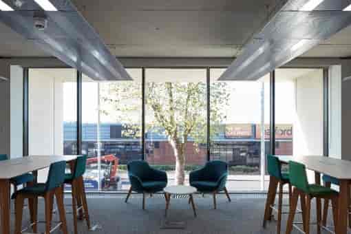 Modern meeting room with casual seating for networking and brainstorming events.