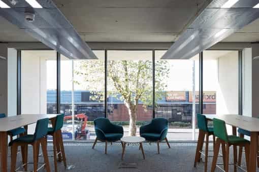 Modern meeting room with casual seating for networking and brainstorming events.