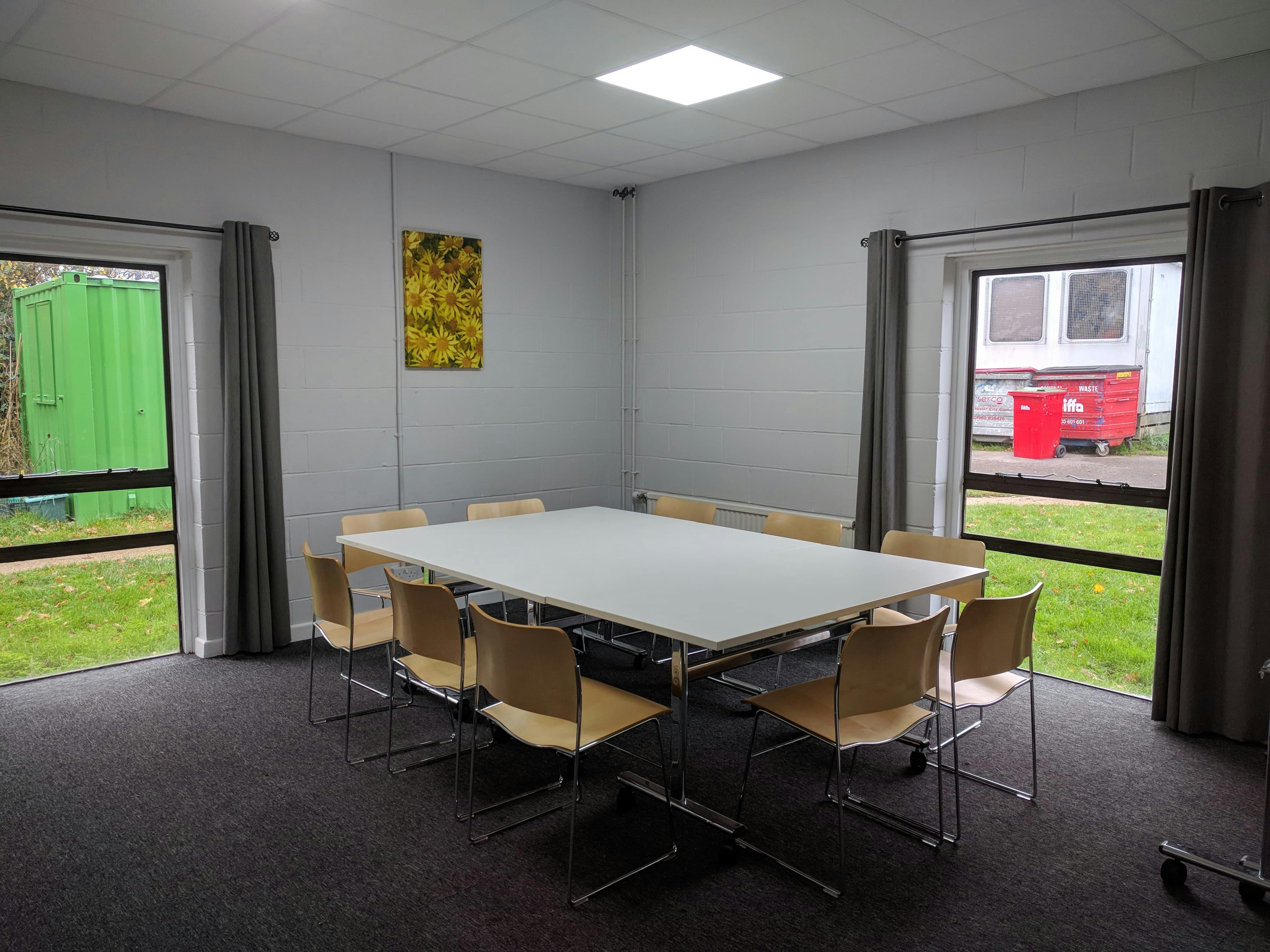 Victory Room at Wickham Community Centre, featuring a central table for meetings and collaboration.