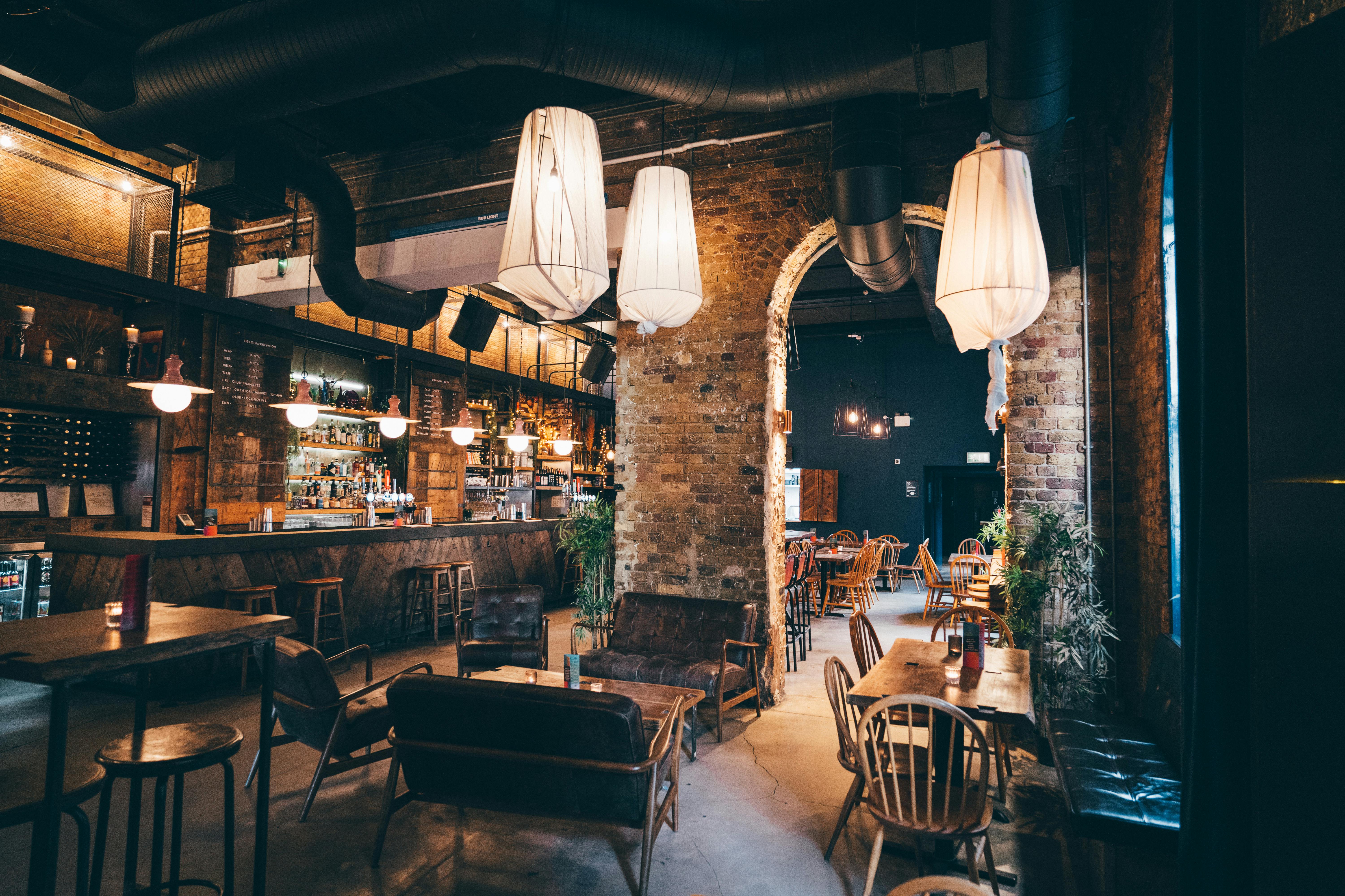 Stylish Oslo Hackney bar with exposed brick, perfect for networking events and gatherings.