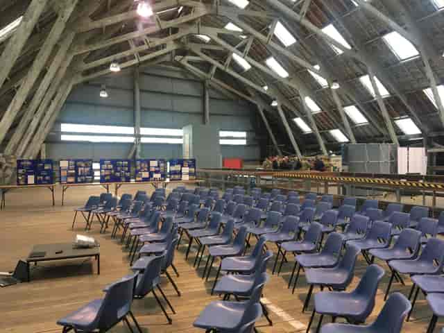 Commissioner's House event setup with blue chairs, ideal for workshops and conferences.