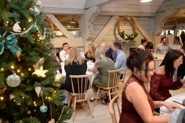 Festive dining setup at The Commissioner's House for corporate holiday events.