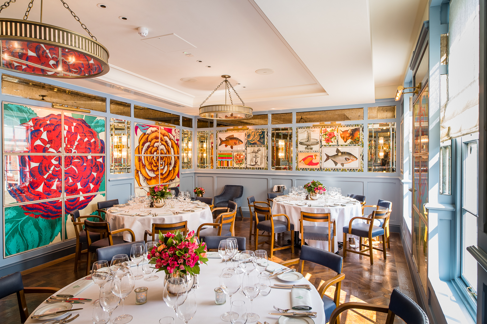 Isabella Room at The Ivy Café Richmond, elegant dining space for events with floral centerpieces.