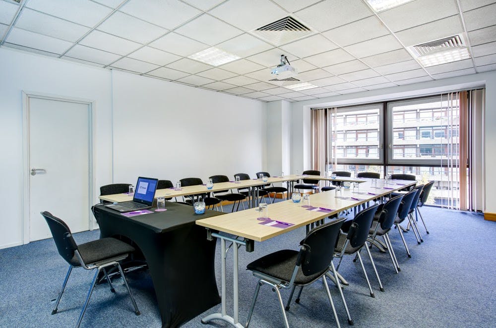 U-shaped meeting room with natural light at CCT Venues Barbican, ideal for workshops.