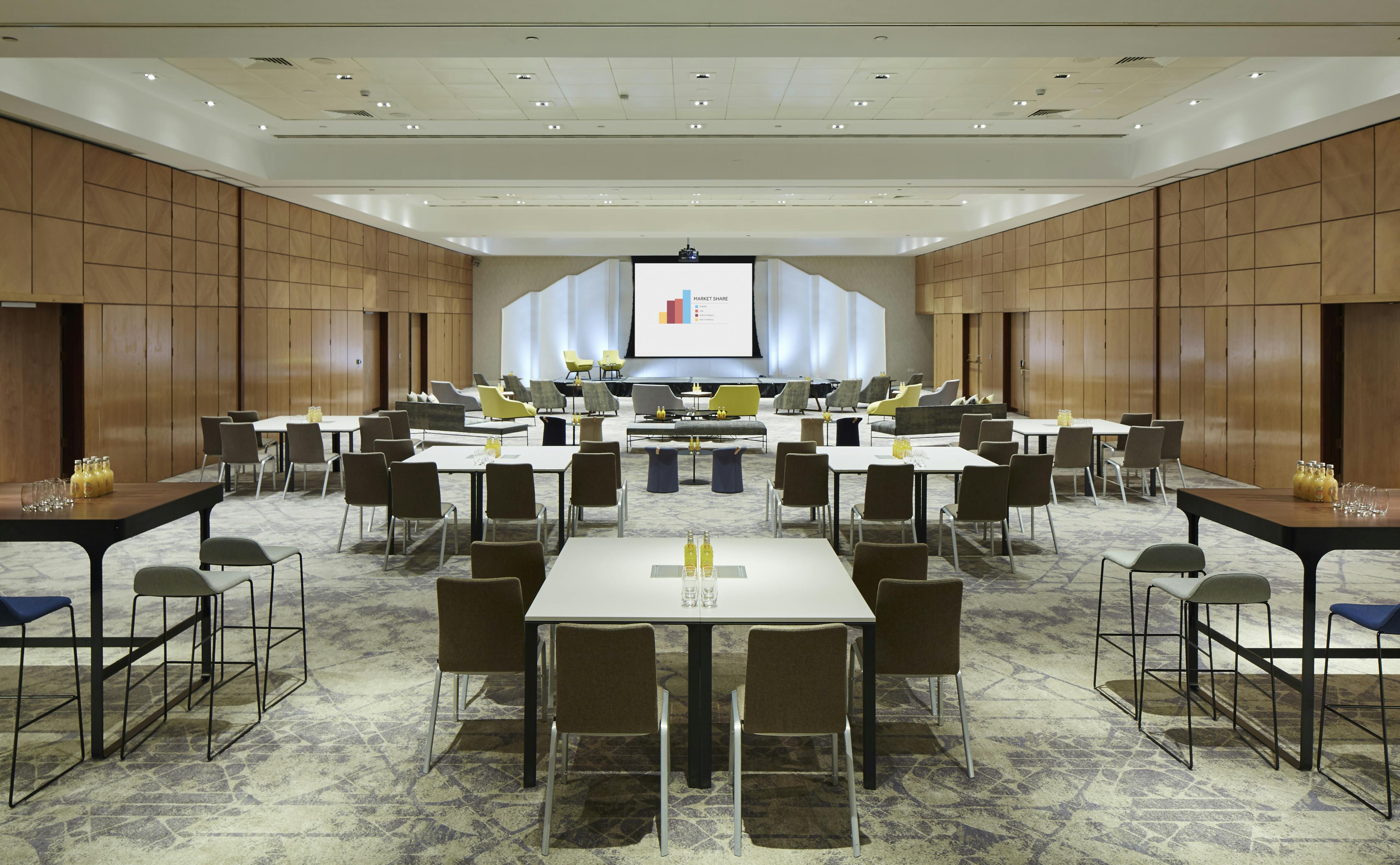 Modern meeting space at London Heathrow Marriott with flexible seating for events.