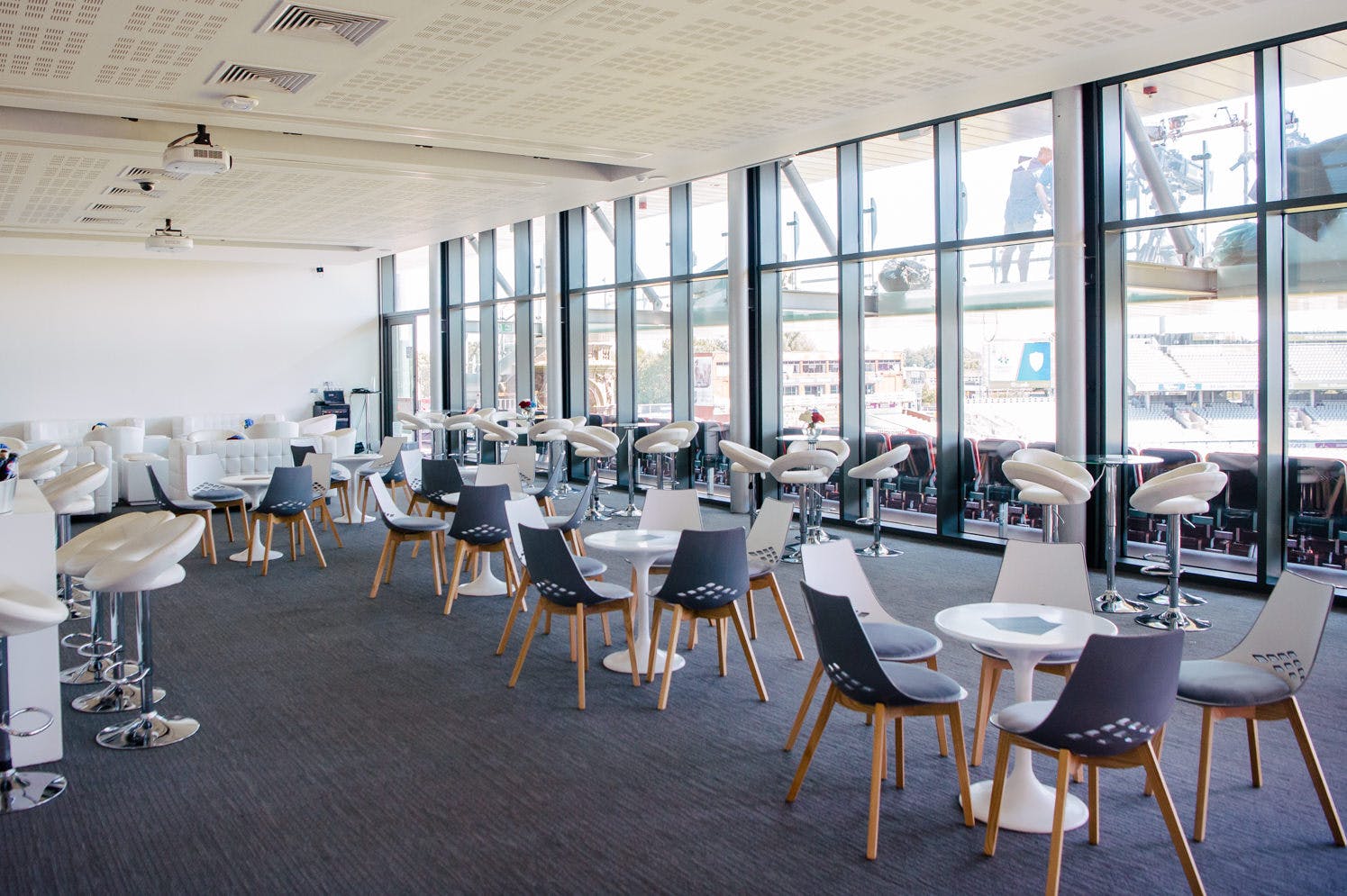 Modern event space in Emirates Old Trafford with natural light for corporate gatherings.