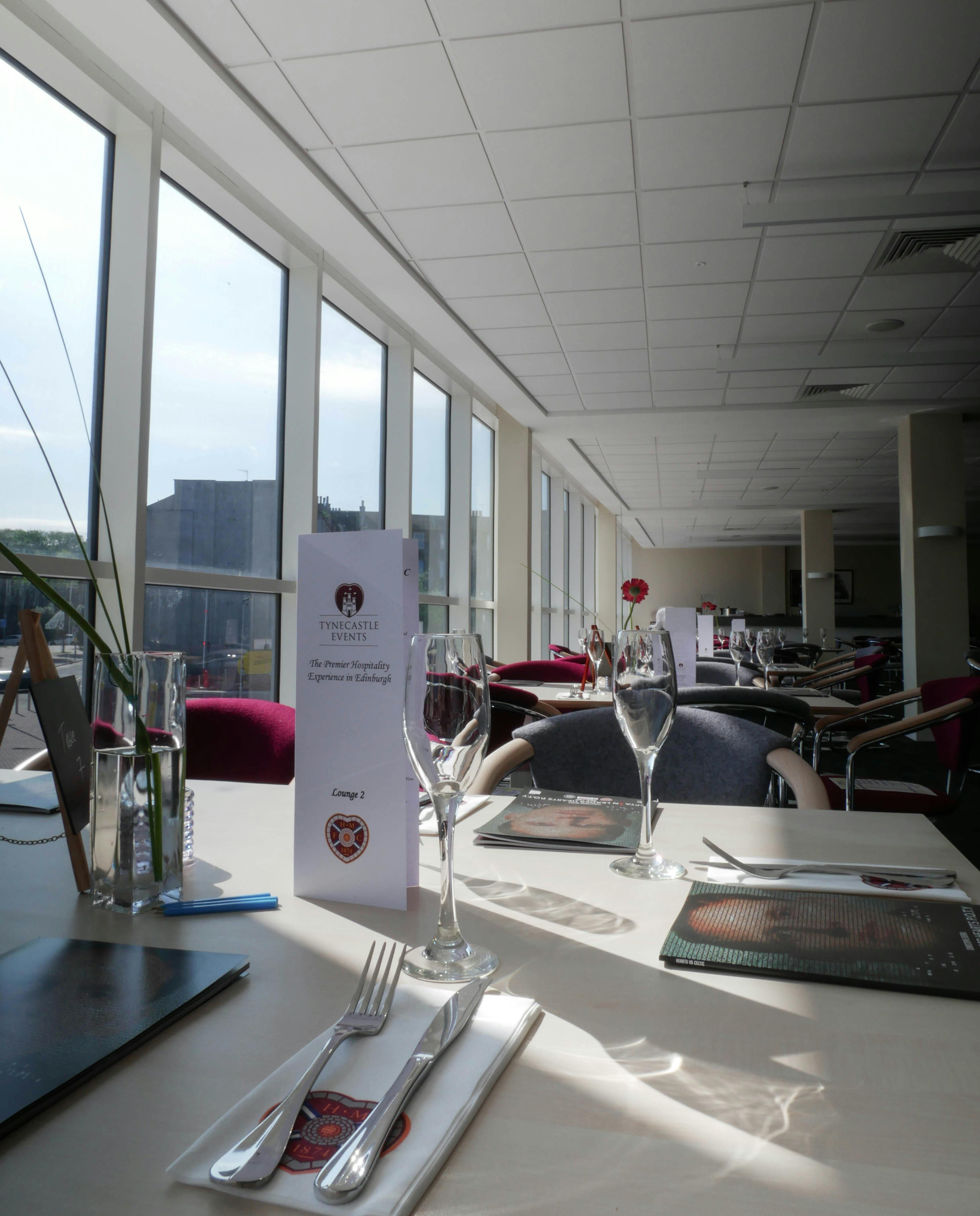 Elegant event space in Tynecastle Park with modern decor for corporate gatherings.