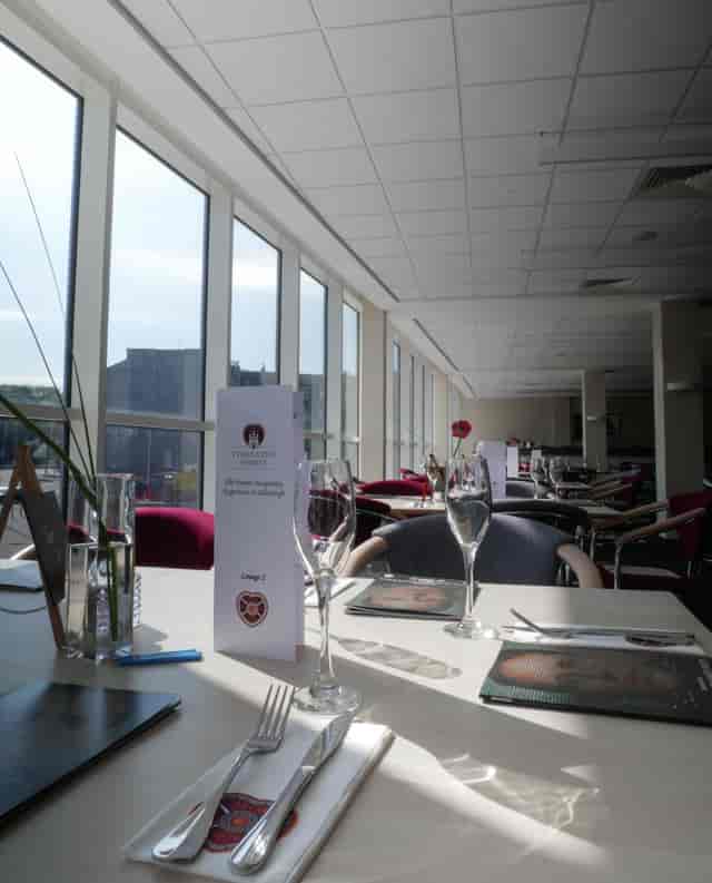 Elegant event space in Tynecastle Park with modern decor for corporate gatherings.