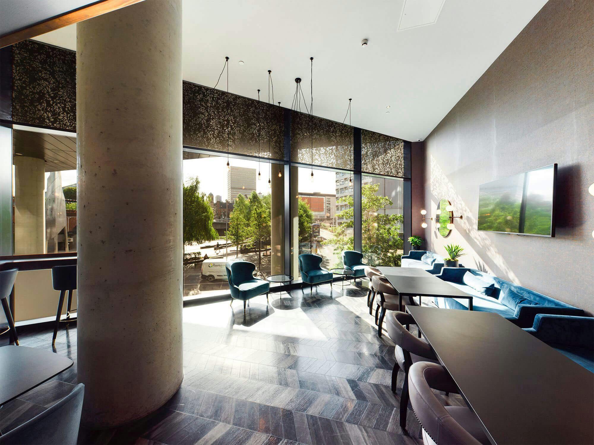 Modern meeting space with large windows at Embankment Lounge, perfect for networking events.