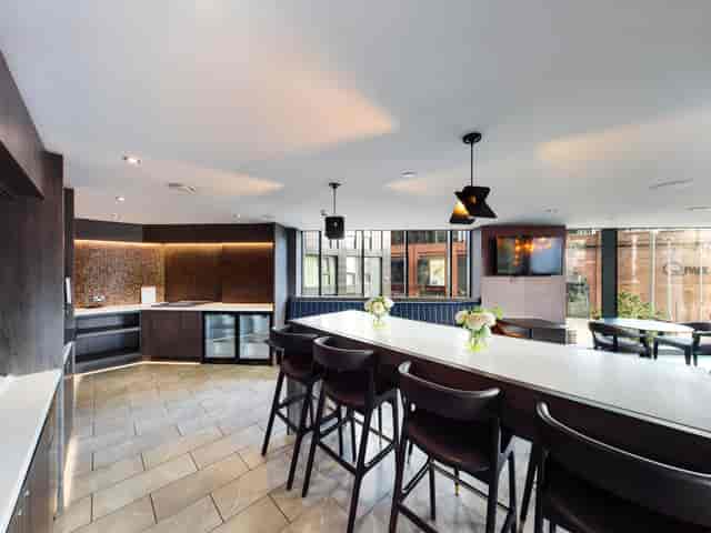 Modern kitchen and dining area in Embankment Lounge, ideal for events and networking.