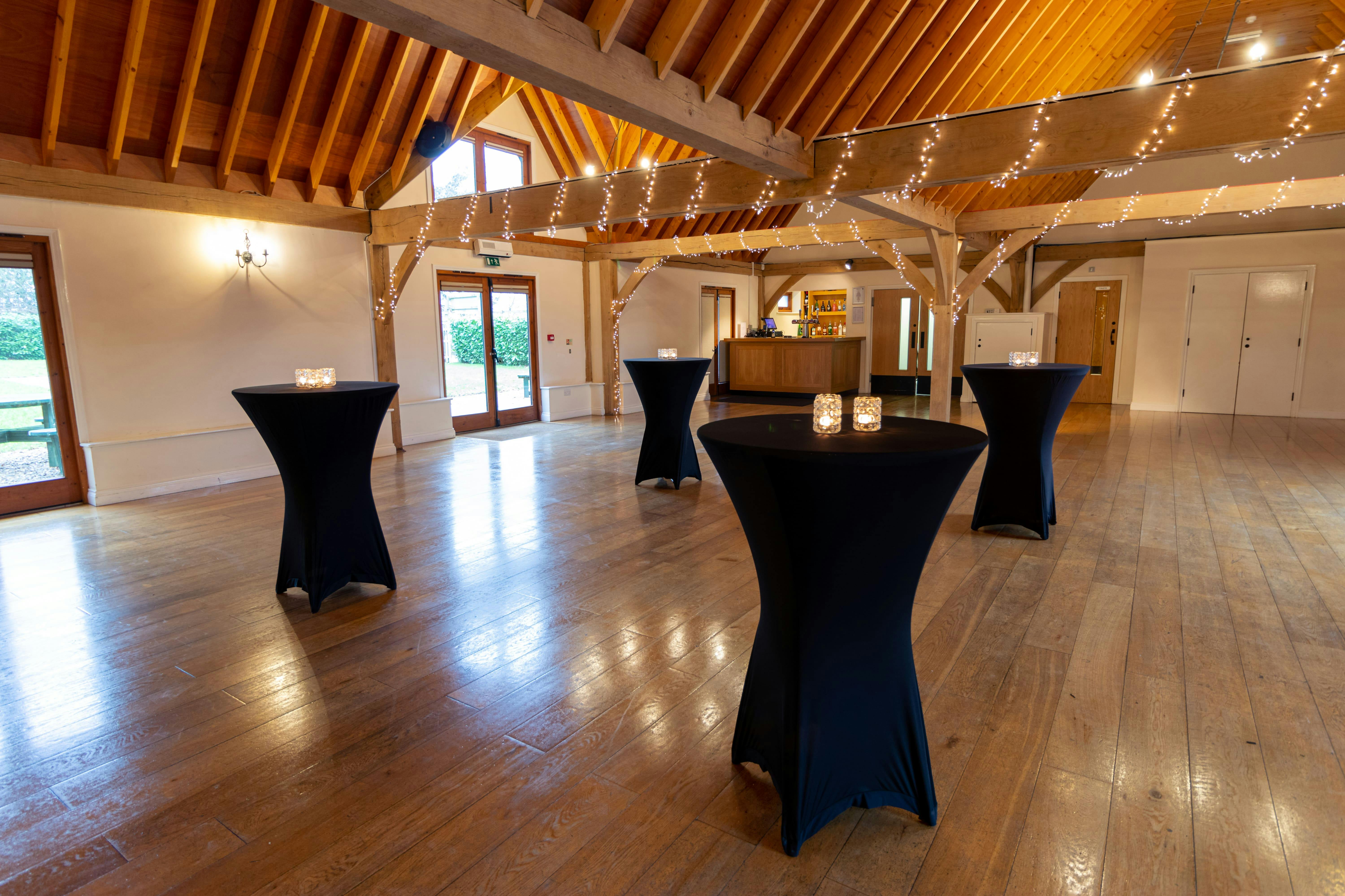 Cobbold Barn at Knebworth House: elegant wooden beams for versatile events and gatherings.