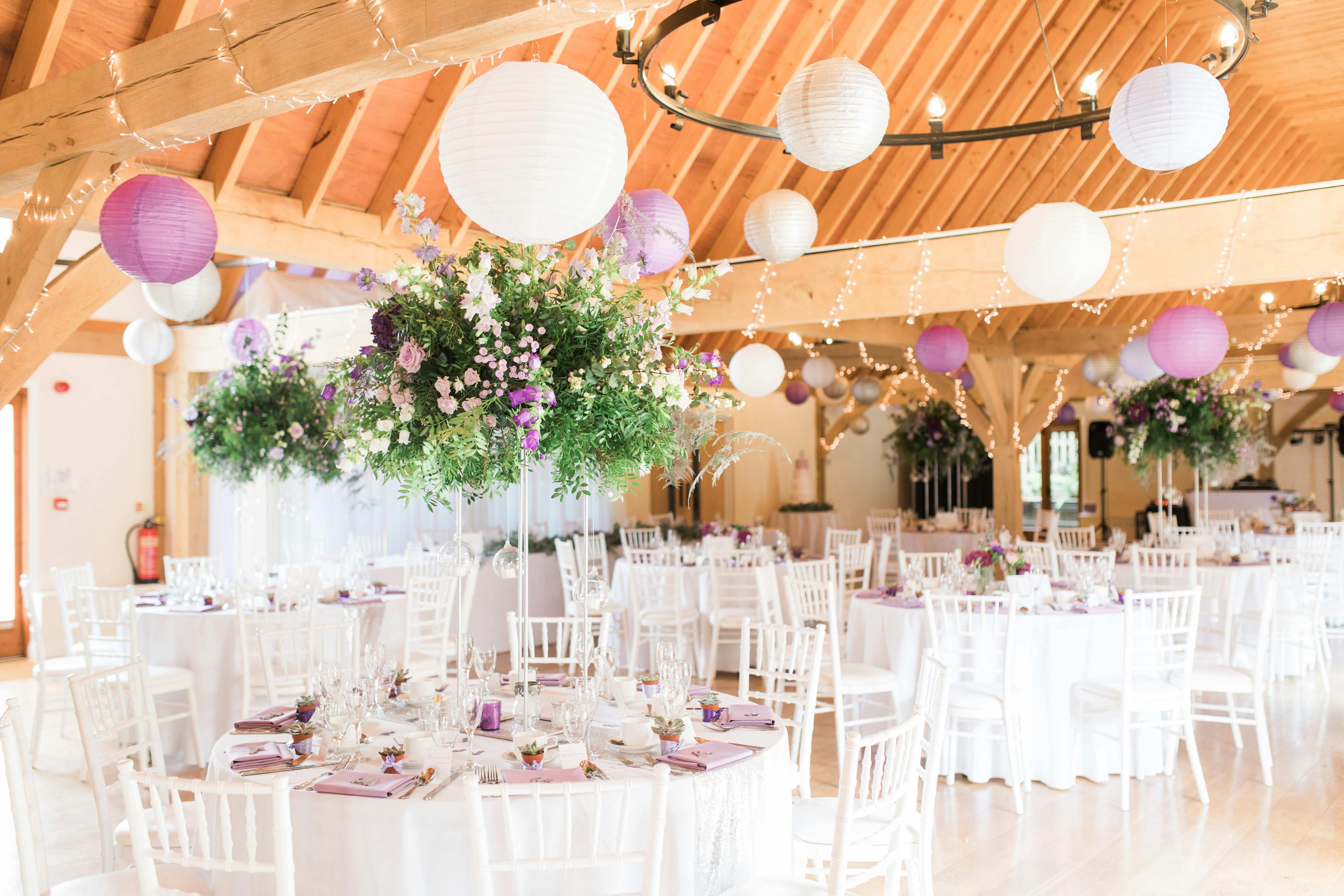 Cobbold Barn event space with elegant tables, ideal for weddings and upscale gatherings.