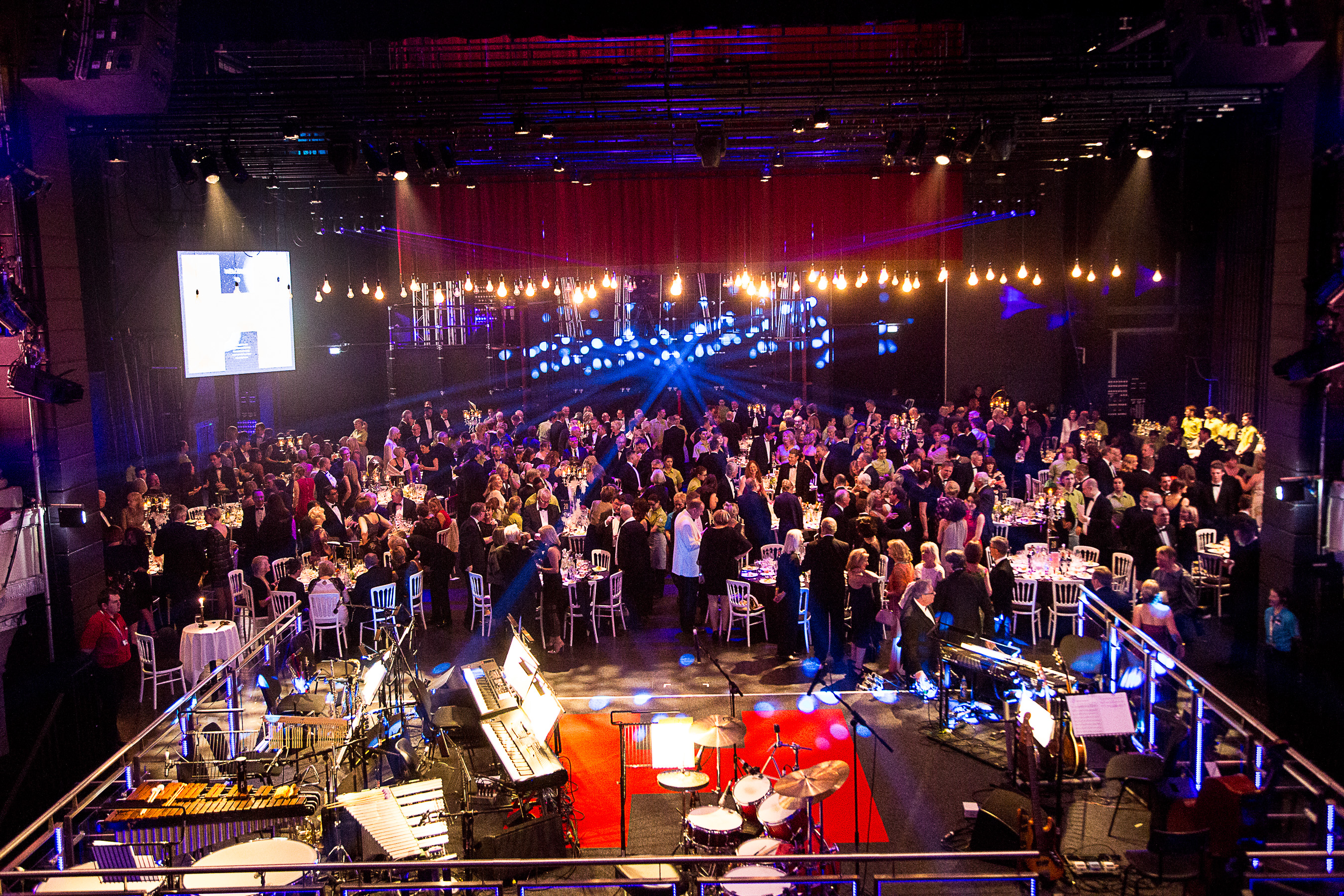 Birmingham Hippodrome auditorium set for a vibrant networking event with elegant tables. - Banner
