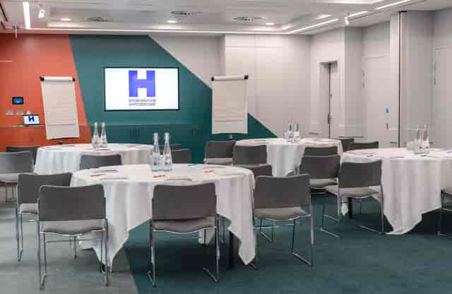 PwC Suite in Birmingham Hippodrome, ideal for workshops with round tables and presentation screen.
