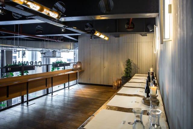 Mezzanine industrial private dining room for corporate events and networking workshops.