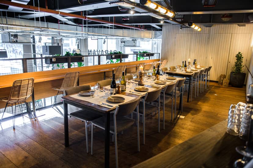 Mezzanine industrial-chic venue for corporate networking and social dining events.