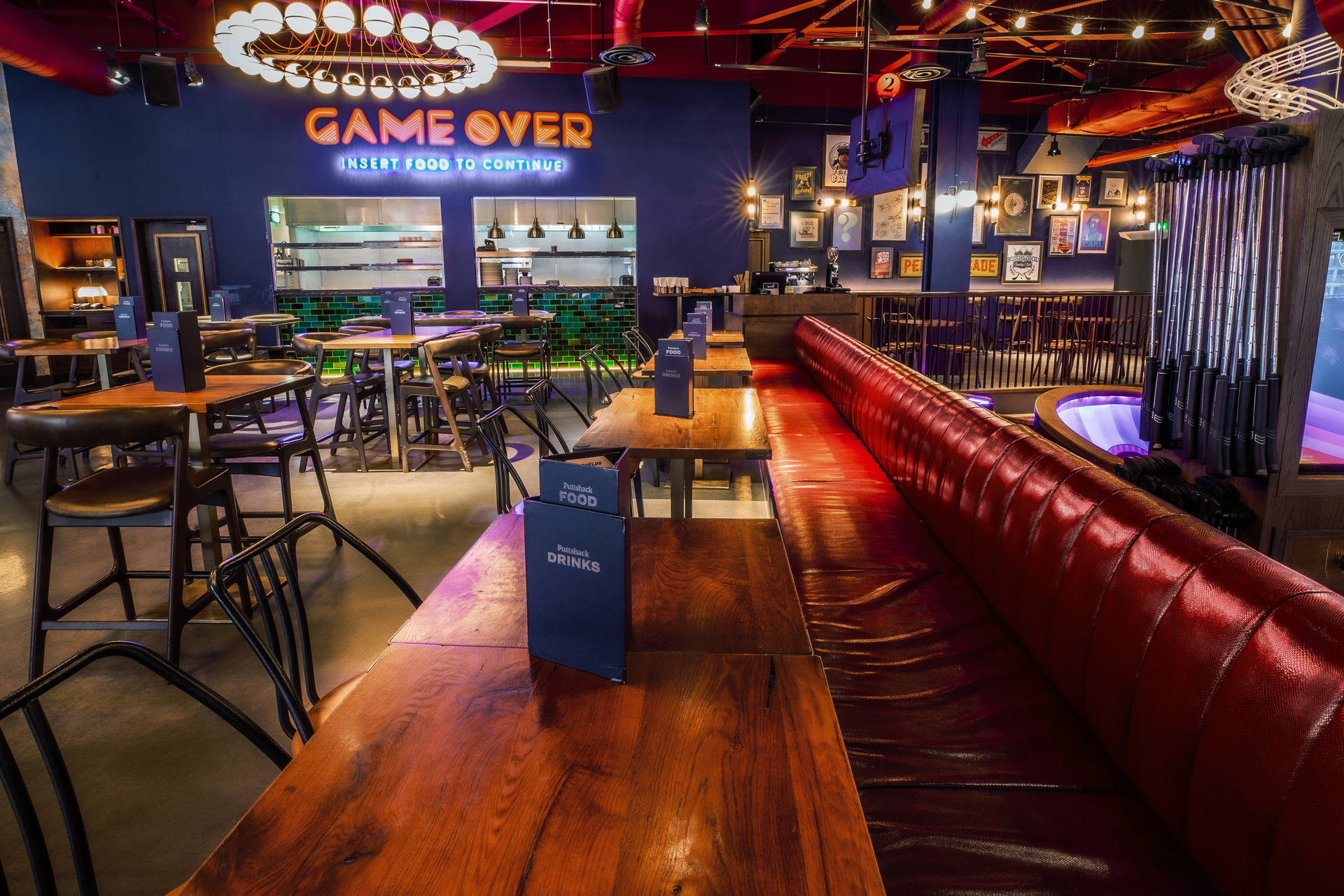 Vibrant event space at Puttshack White City for networking and team-building activities. - Banner