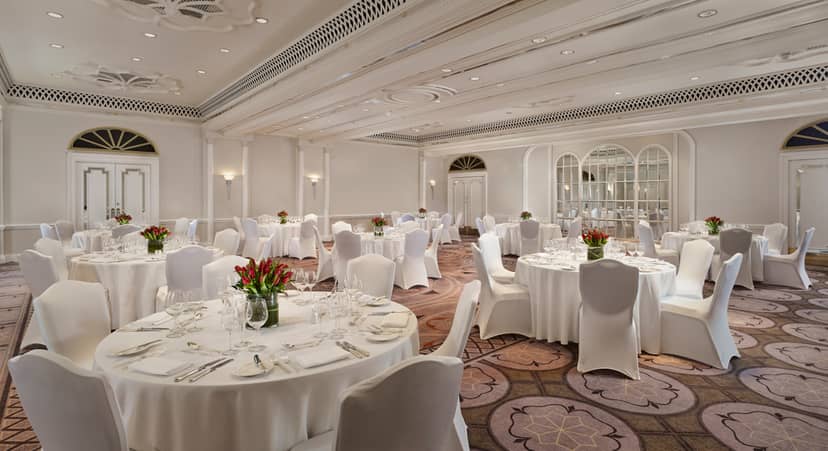 Elegant Tudor Rose event space with white linens, perfect for weddings and corporate events.