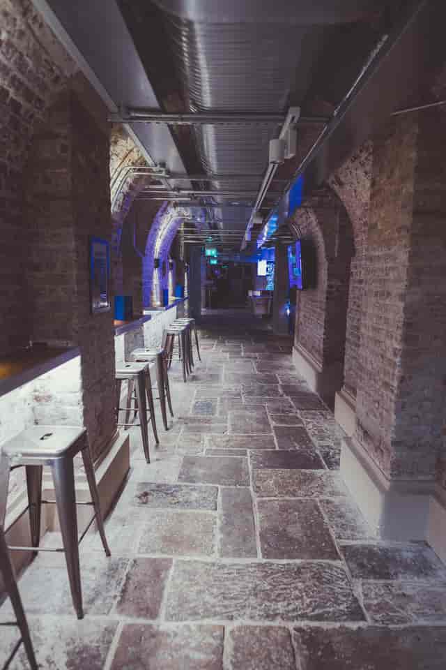 Stylish modern venue with exposed brick arches for intimate gatherings and networking events.