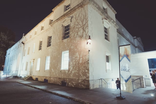 Lower Deck venue exterior at night, ideal for events with inviting atmosphere.