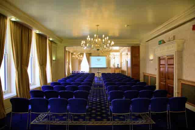 Elegant meeting room with blue chairs, perfect for conferences at 113 Chancery Lane.