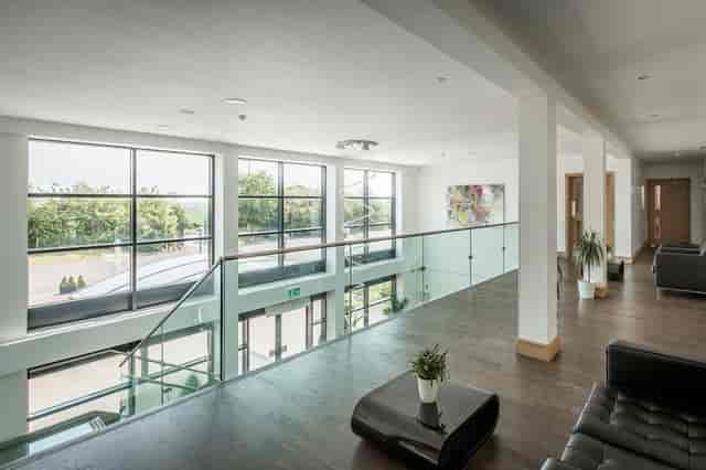 Modern Premier Suite with large windows, perfect for networking events and gatherings.