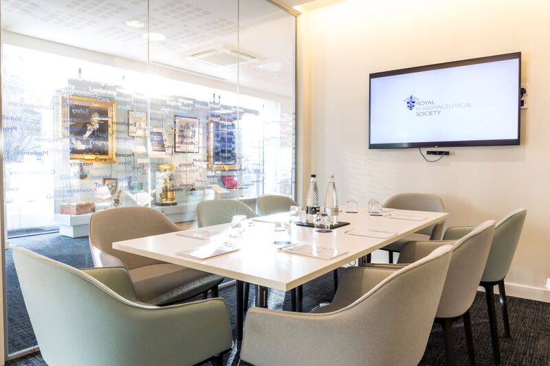 Modern meeting room at The Royal Pharmaceutical Society with glass walls, ideal for conferences.