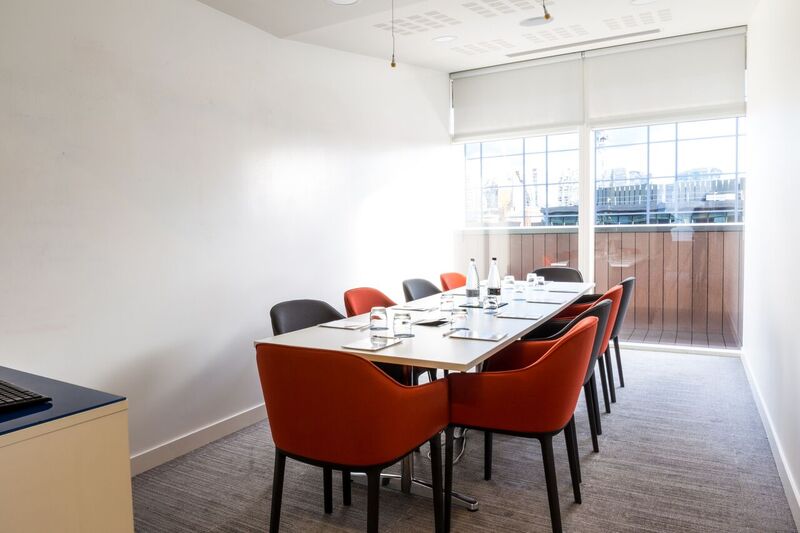 Modern meeting room at The Royal Pharmaceutical Society with natural light, ideal for workshops.