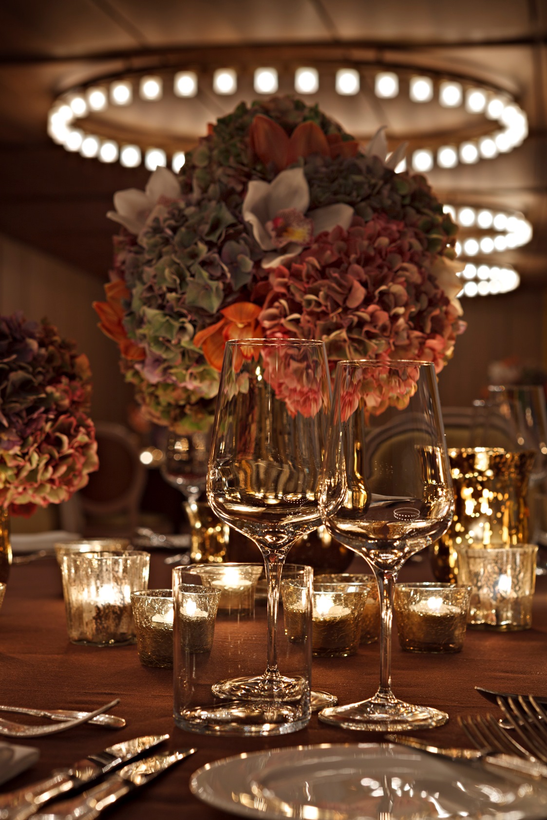 Elegant table with floral centerpieces at Queensberry, Hotel Cafe Royal for upscale events. - Banner