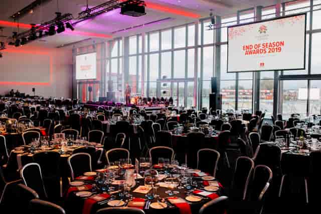 Elegant awards ceremony setup at The Point, Emirates Old Trafford with fine dining tables.