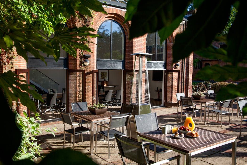 Outdoor meeting space at New Place Hotel, Hampshire with modern furniture for events.