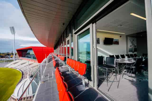 Modern Executive Boxes at Emirates Old Trafford with balcony, ideal for corporate events.
