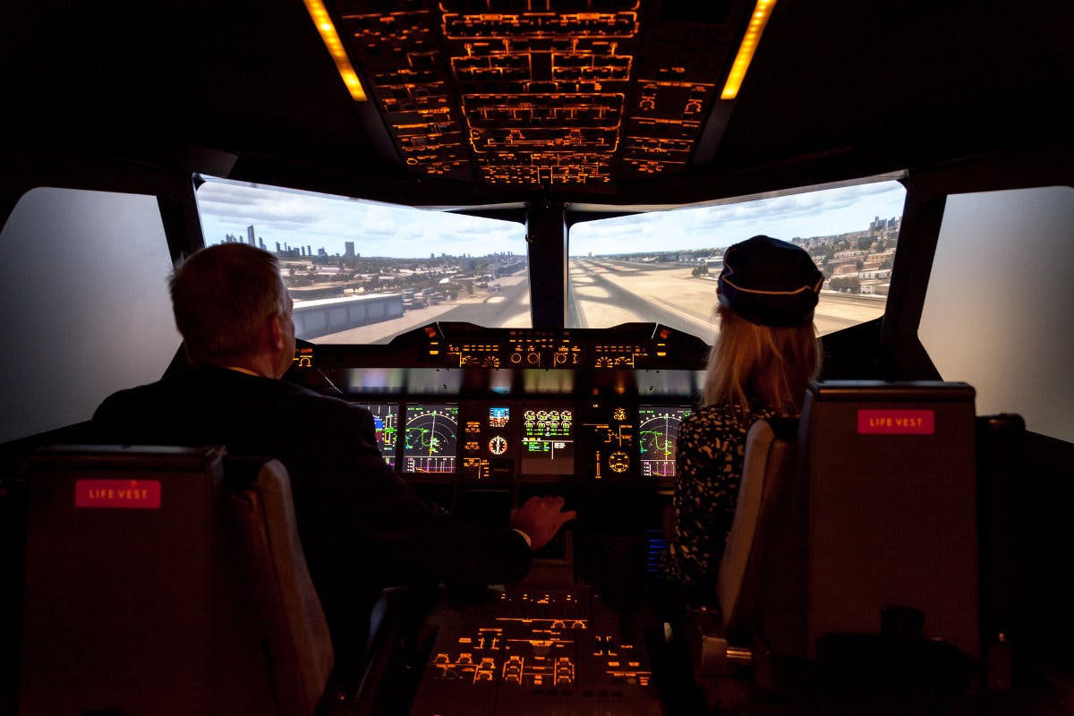 Flight simulator at Emirates Aviation Experience for team-building events and corporate retreats.