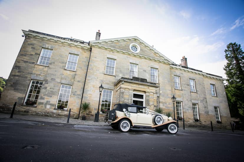 Elegant Proud Country House venue with classic architecture for upscale events and weddings.