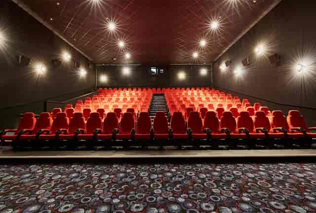 Modern Cineworld Birmingham theater with red seating for corporate events and film screenings.