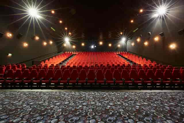 Large screen theater with red seating in Cineworld Birmingham for events and screenings.