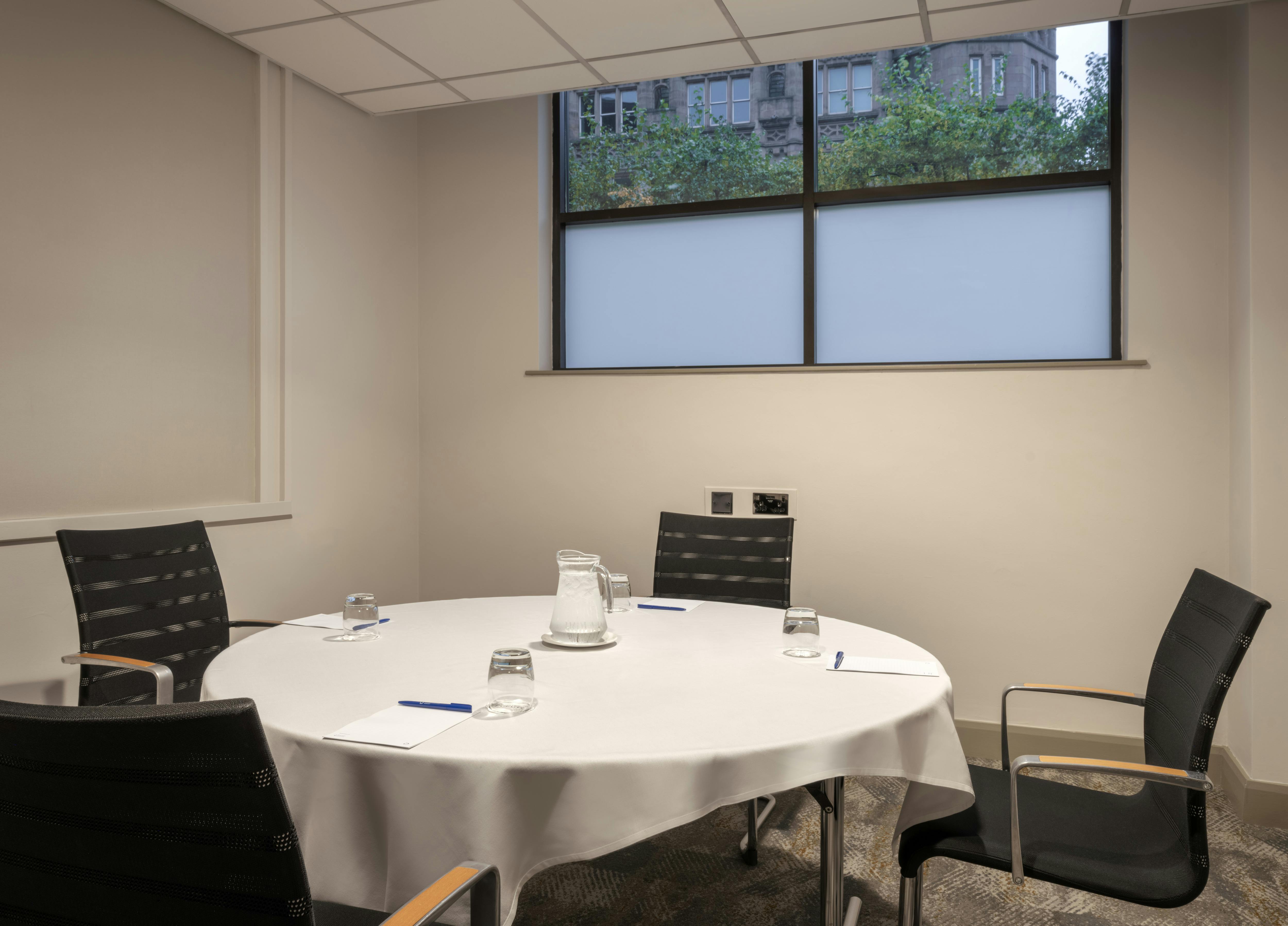 Victoria Room at Delta Hotels Liverpool: round table meeting space for workshops.