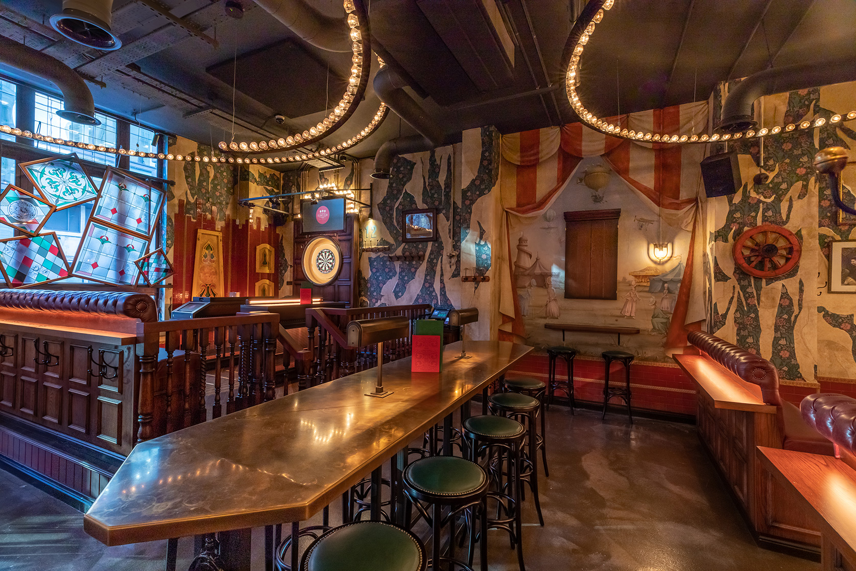Mini Fayre at Flight Club Manchester with vibrant decor for networking and team-building events.