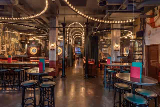 The Old Fayre at Flight Club Manchester, featuring vintage decor and flexible seating for events.