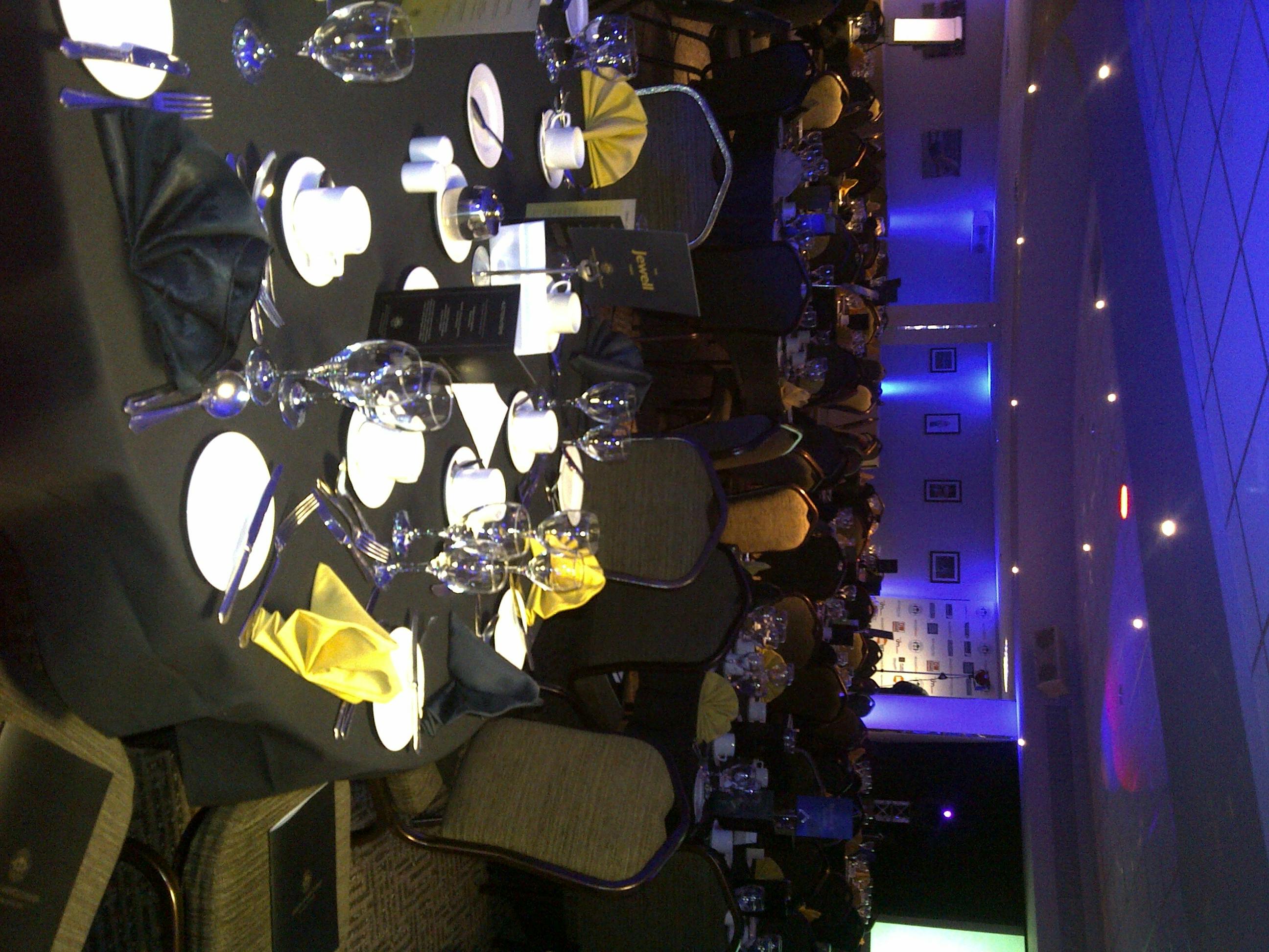 Elegant banquet table in DW Sports Fitness Lounge for formal events and networking.
