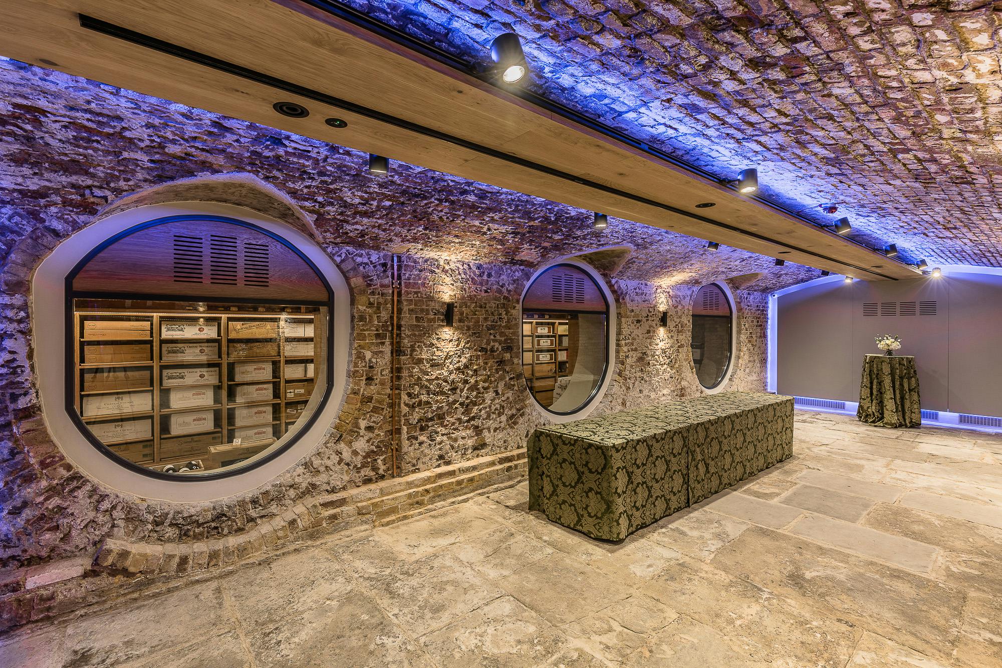 London Bridge Arches in Glaziers Hall, featuring exposed stone walls for elegant events.